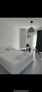 A bed or beds in a room at Eleni's Studios