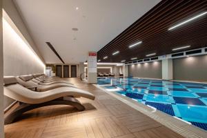 a large swimming pool in a building with a large pool at Grand Harilton Otel in Istanbul