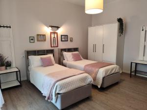 Postel nebo postele na pokoji v ubytování La Bicicletta Rooms