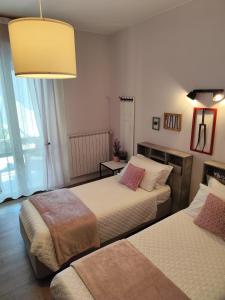 Postel nebo postele na pokoji v ubytování La Bicicletta Rooms