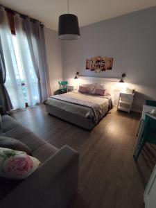 Postel nebo postele na pokoji v ubytování La Bicicletta Rooms