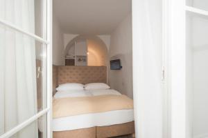 Postel nebo postele na pokoji v ubytování Residence Fink Central Apartments