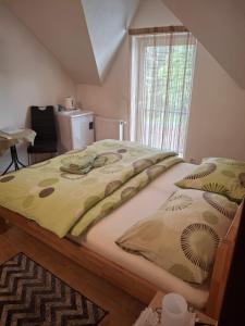 A bed or beds in a room at Vila Lesana
