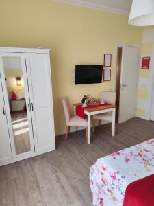 TV a/nebo společenská místnost v ubytování La Bicicletta Rooms