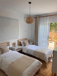 Postel nebo postele na pokoji v ubytování Villa Daphne - Coral Bay - Surrounded by Nature - Absolute Privacy