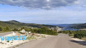 an empty road with a view of the ocean at Vila Ivana Dolores in Vinišće
