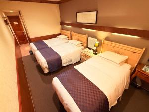 Postel nebo postele na pokoji v ubytování Hotel Gasthof