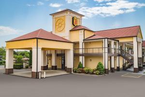 a rendering of a building with a clock tower at Super 8 by Wyndham Columbia in Columbia