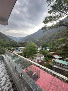 a view of a town from the balcony of a house at Shelbys Abode in Dehradun