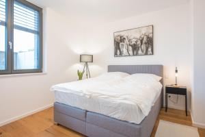 Ένα ή περισσότερα κρεβάτια σε δωμάτιο στο Schlossberg Maisonette NEU Terrasse Ausblick
