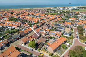 an aerial view of a town with orange roofs at Westkapelle appartement en vakantiehuis in Westkapelle
