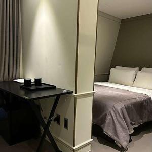 Postel nebo postele na pokoji v ubytování Hotel Gaden