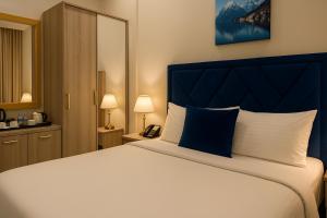 Una cama o camas en una habitación de Saraya Palace Hotel