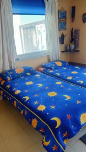 A bed or beds in a room at CASA CALMA