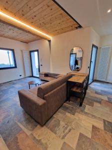 a large living room with a couch and a mirror at Dimore d'Oltremare - Appartamento Libeccio in Lavagna