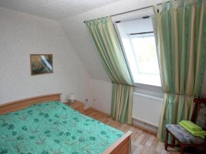 Ein Bett oder Betten in einem Zimmer der Unterkunft Snug Apartment in Kröpelin Germany