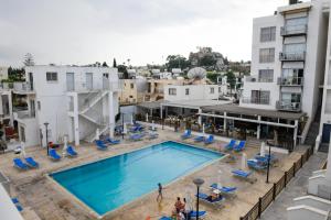an overhead view of a swimming pool on a building at Sweet Memories STANDARD Apts in Protaras