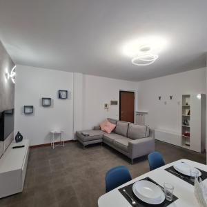 a living room with a couch and a table at Casa Gavazzeni Il Sogno in Bergamo