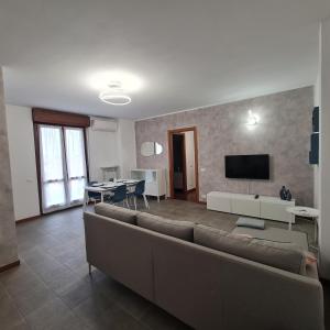 a living room with a couch and a tv at Casa Gavazzeni Il Sogno in Bergamo