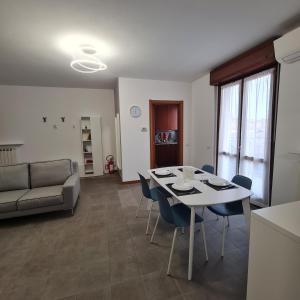 a living room with a table and chairs and a couch at Casa Gavazzeni Il Sogno in Bergamo
