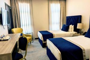 Una cama o camas en una habitación de Saraya Palace Hotel