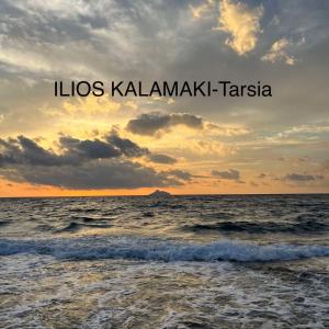 a sunset over the ocean with the words los kalamazakis taza at Ilios Kalamaki in Kalamaki +60 photos