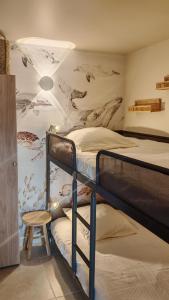 a bedroom with two bunk beds and a mural at Jolie Maisonnette vençoise in Vence +25 photos