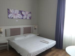 Postel nebo postele na pokoji v ubytování Lodges le Mura