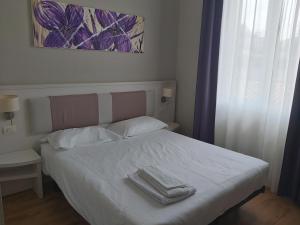 Postel nebo postele na pokoji v ubytování Lodges le Mura
