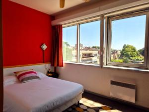 Postel nebo postele na pokoji v ubytování Arche Hotel