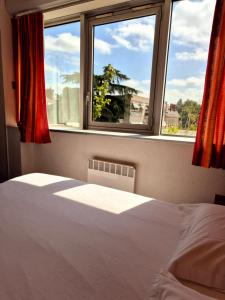 Postel nebo postele na pokoji v ubytování Arche Hotel