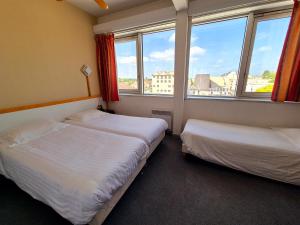 Postel nebo postele na pokoji v ubytování Arche Hotel