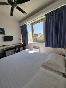 Postel nebo postele na pokoji v ubytování Arche Hotel