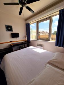 Postel nebo postele na pokoji v ubytování Arche Hotel