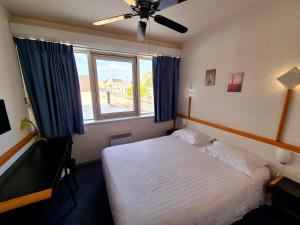 Postel nebo postele na pokoji v ubytování Arche Hotel