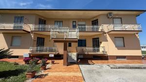 a building with balconies on the side of it at PP06 - Porto Potenza, trilocale con aria condizionata vicino al mare in Porto Potenza Picena