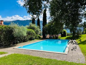 a swimming pool in the yard of a house at Apartment Bella Vista In Mezzegra with POOL sleeps 6- by Italian Apartments in Mezzegra