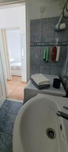 a white bath tub in a bathroom with a window at House Feniks, 2 bedrooms, private parking, Starlink! in Milna