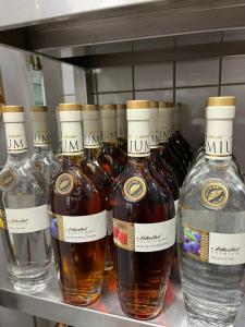 a group of bottles of alcohol on a shelf at Landhaus Obere Säge in Schömberg