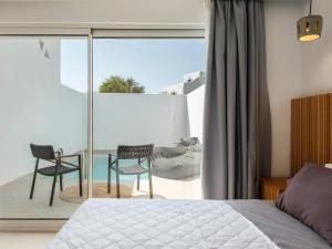 Cama ou camas em um quarto em Mykonos Drops