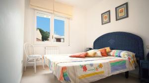 a bedroom with a bed and a window at Villa Nuria by HR COSTABRAVA in Platja d'Aro +31 photos