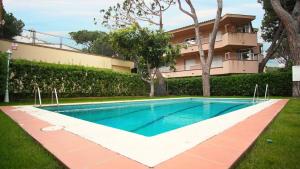 a swimming pool in front of a building at Villa Nuria by HR COSTABRAVA in Platja d'Aro