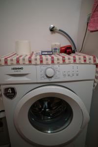 a package on top of a washing machine at Mitatos "Matthew" in Moutsoúna