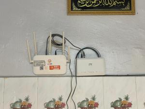 a couple of electrical devices sitting on a wall at D'Salbiah Homestay in Kampong Kemaman