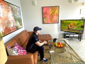 TV a/nebo společenská místnost v ubytování Las Olas Suite - Bajamar