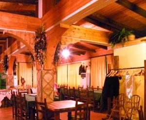 a dining room with a table and chairs in a room at Agriturismo La Ginestra in Cercemaggiore