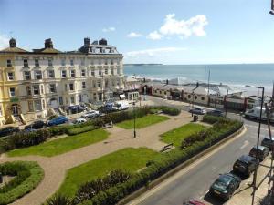 a view of a street with a building and the ocean at The Lookout, Bridlington in Bridlington