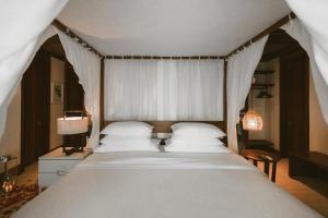 Cama ou camas em um quarto em Pousada Maravilha
