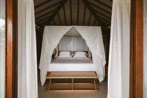 Cama ou camas em um quarto em Pousada Maravilha