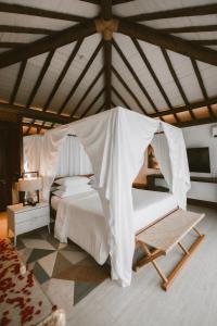 Cama ou camas em um quarto em Pousada Maravilha